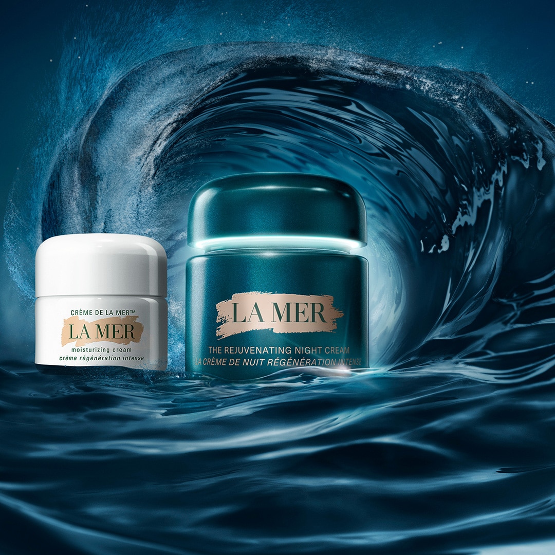 The New Rejuvenating Night Cream with animating 15ml Moisturisers either side, nested under a large wave in the sea 